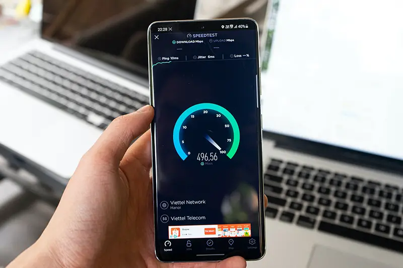 Black smartphone displaying internet speed test