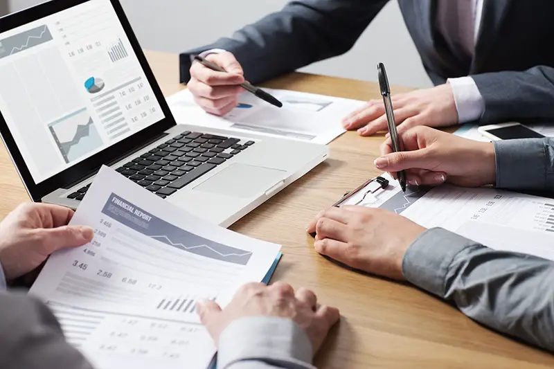 Business professionals working together at office desk