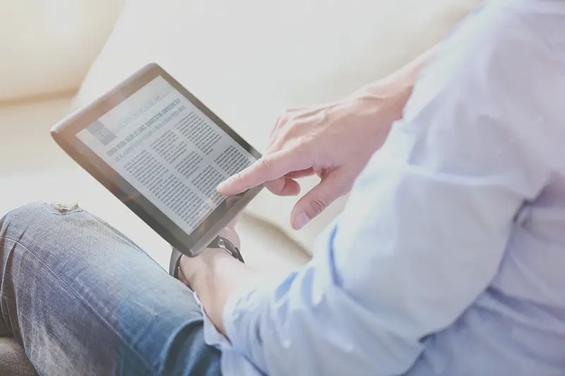 man reading news online