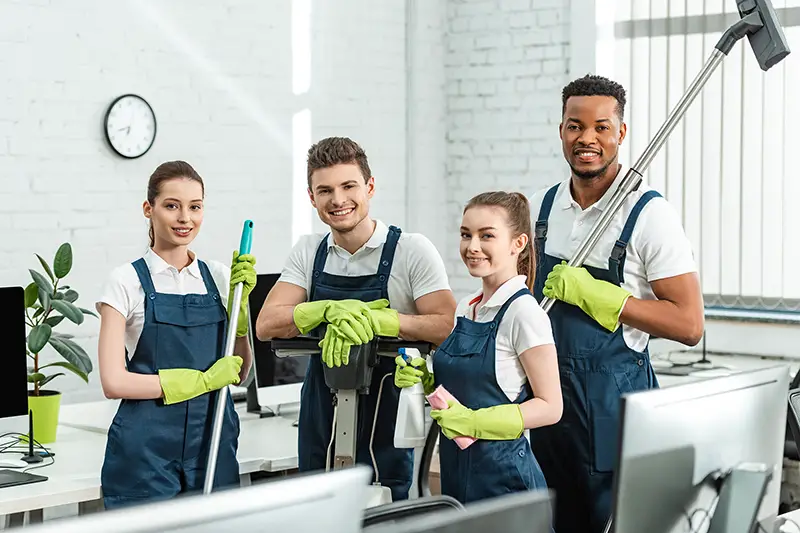 A group of happy multicultural cleaners