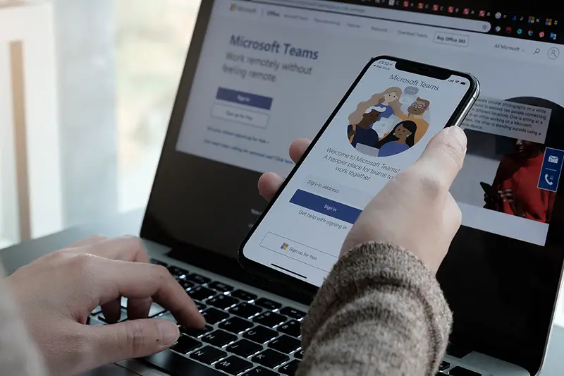A working from home employee downloading the Microsoft Teams social platform