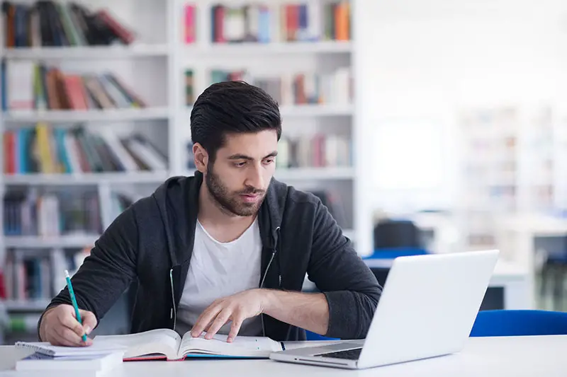 Young man taking an online exam