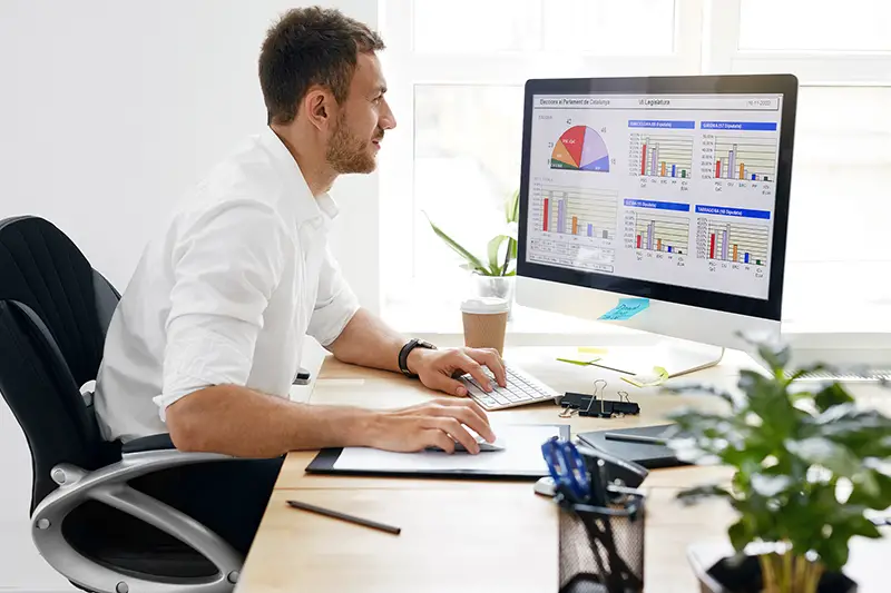 Young Business Man Working On Computer In Office