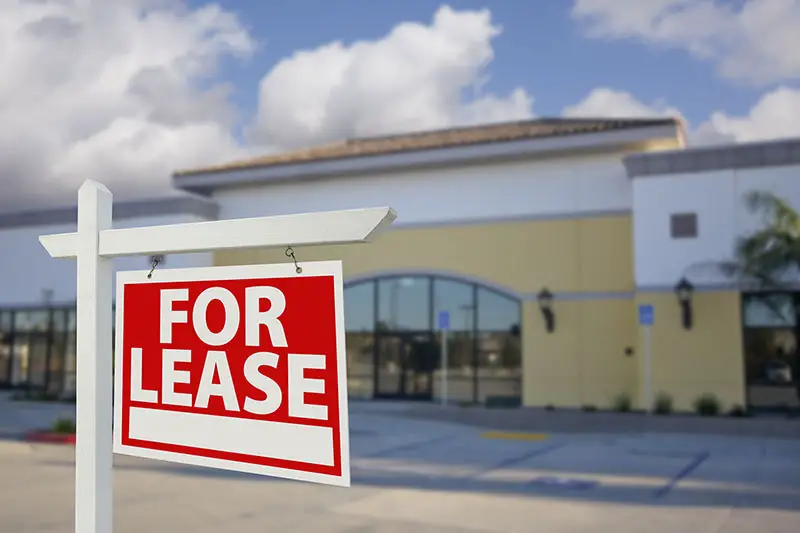 Vacant Retail Building For Lease Real Estate Sign