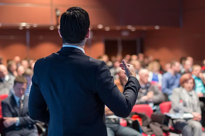 Speaker giving a talk on corporate business conference