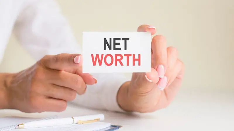 Net worth text written in blank business card