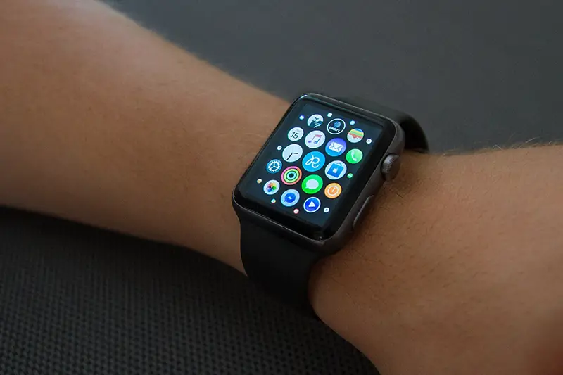 Black apple watch on person hand