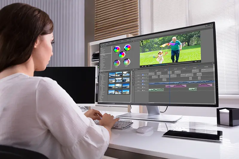 woman editing a video on her computer