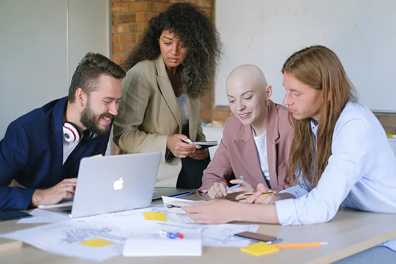 group of diverse business people working together with laptop