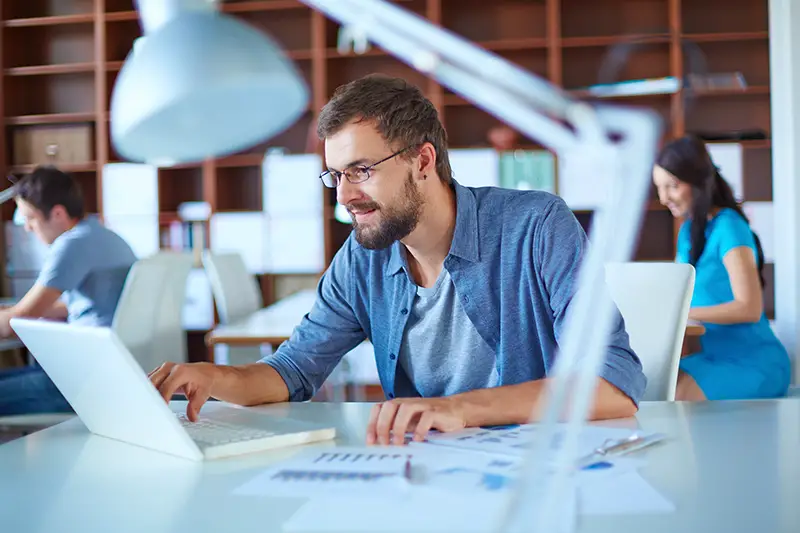 Man in casual working on his desk in the office