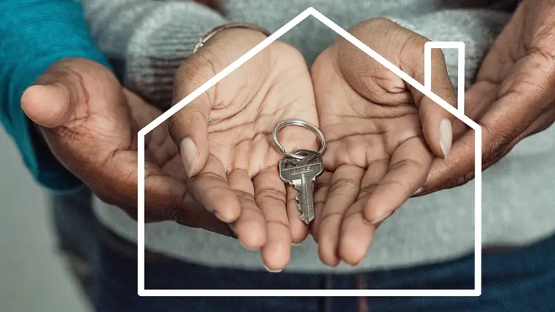 House key on couple's hand