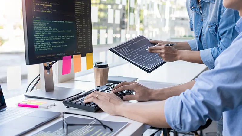 People working in front of computer desk