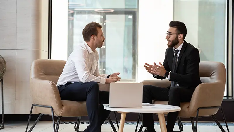 Businessman talking to business consultant expert