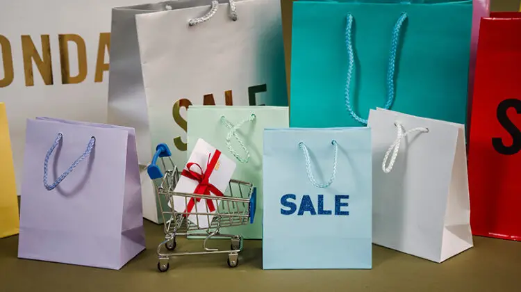 paper bags with sale text on the table