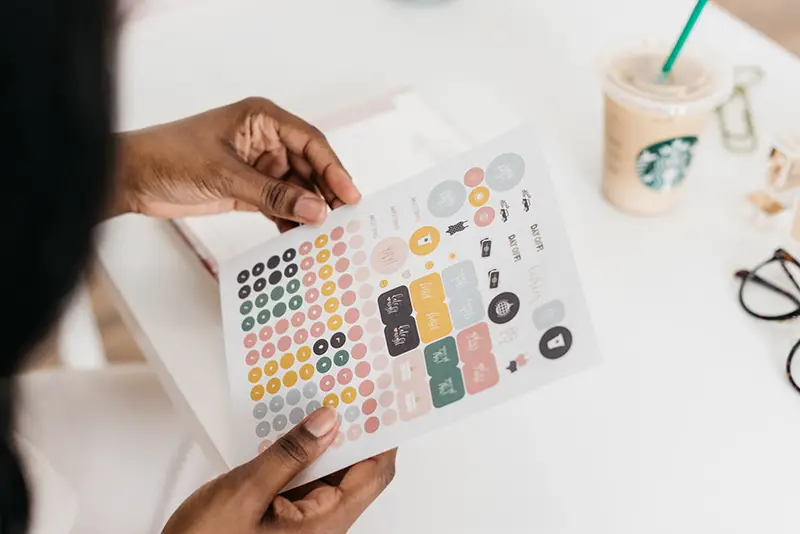 Person holding white printing paper