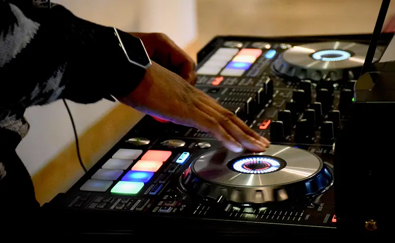Person using DJ turn table