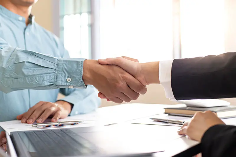 Financial accountants and marketers shaking hand