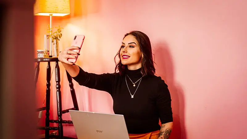 Young woman influencer making a selfie