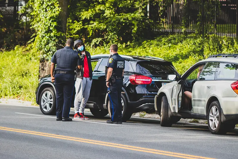 Policemen investigating the car accidents on the road side