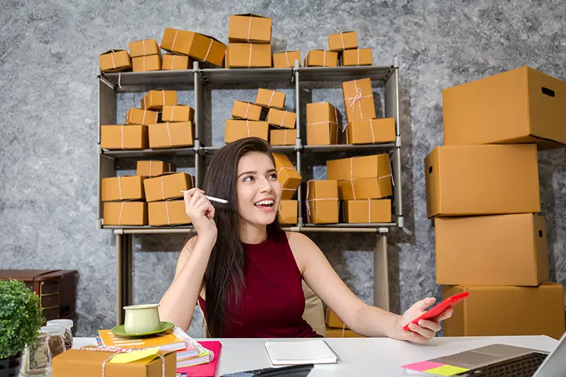 Young business woman working on her desk