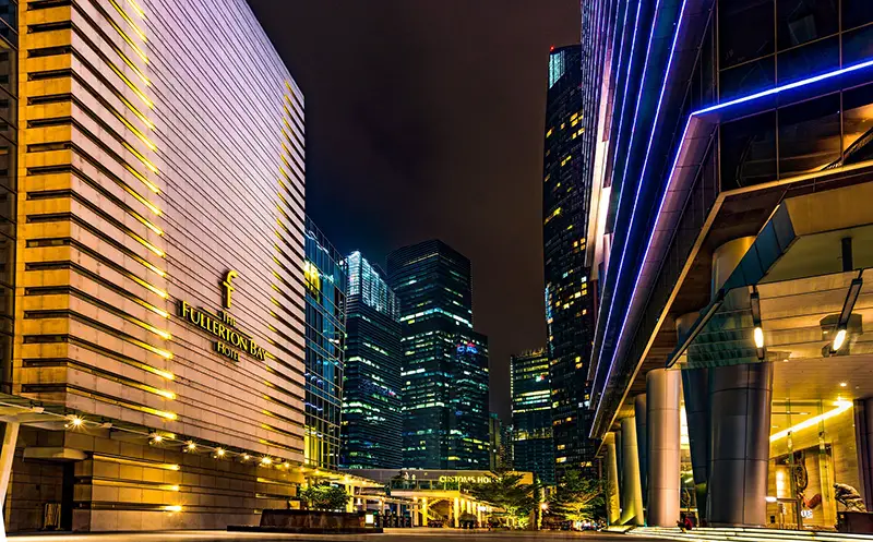 Hotel buidings and lights on during night time