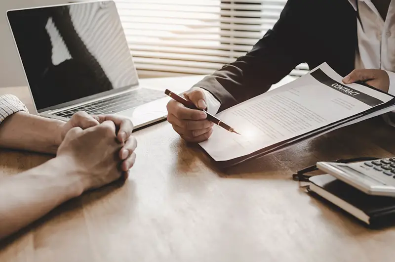 Businessmen having a contract signing for business license