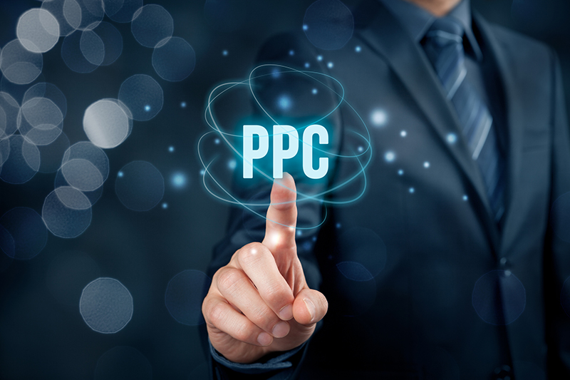 Businessman pointing on virtual screen PPC concept