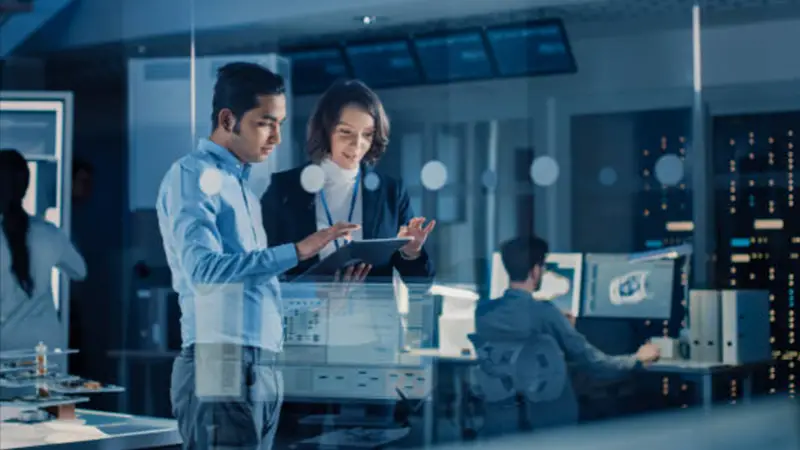 Man and woman using black iPad inside the office