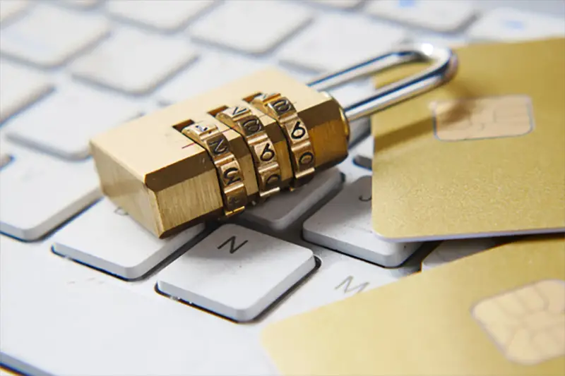 Padlock on keyboard next to sim cards data security