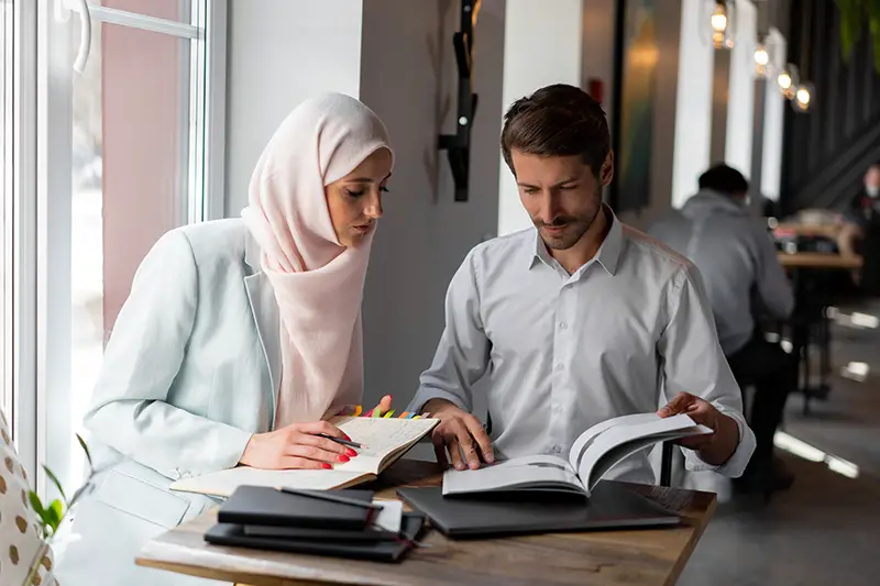 male and female Arabian at work