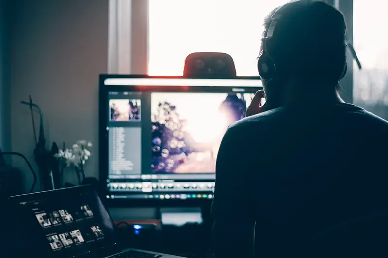 Person editing video on the computer