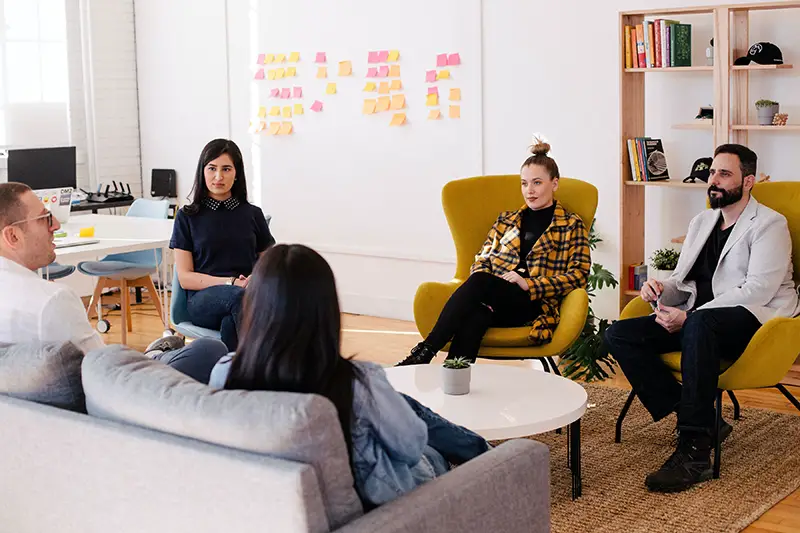 people having meeting in a living room