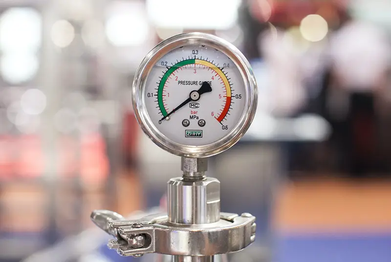Selective focus photography of gauge