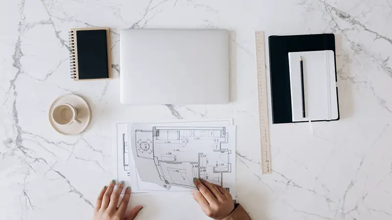 An architect work table with tools and blueprints