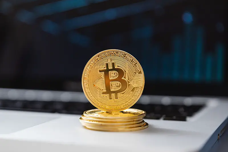 Gold round coin on white table