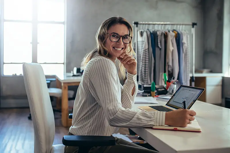 Dropshipping business owner working in her office.