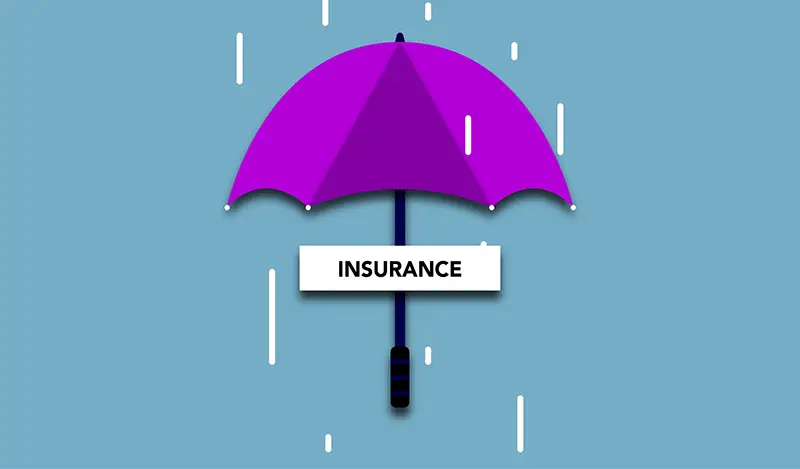 Cutout paper appliques of Insurance inscription under umbrella