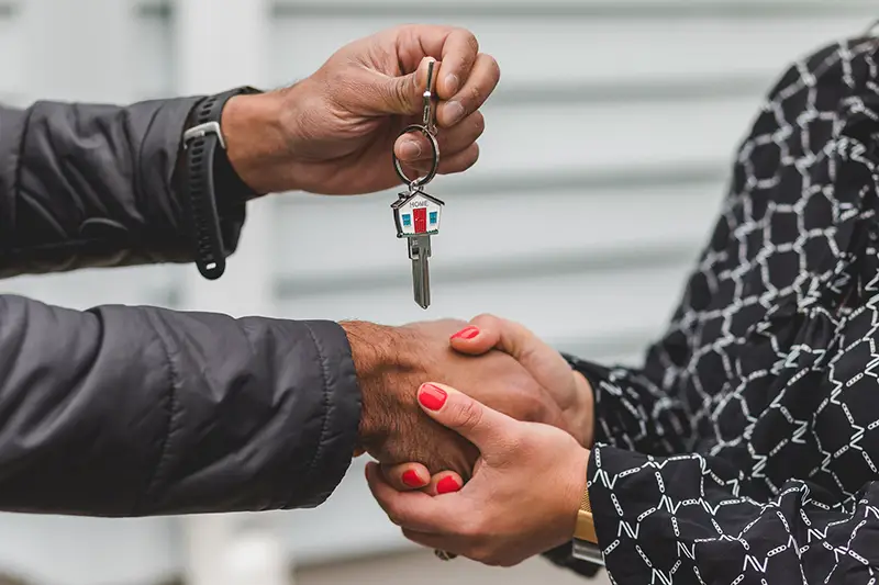 Person holding silver key