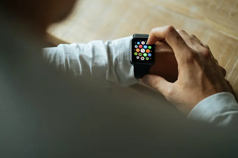 Man using black Apple Watch