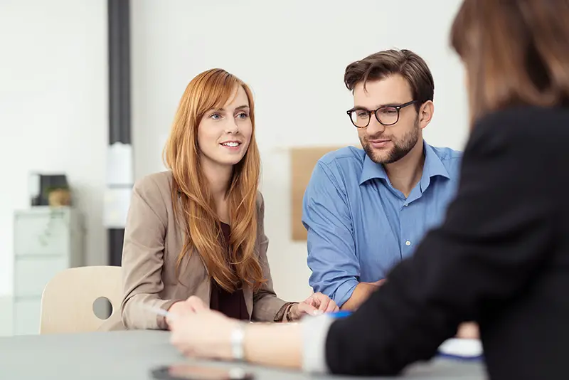 Young couple talking to a business consultant