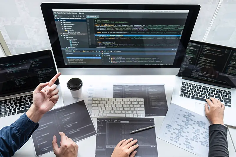 Team of developer programmer working on project in software development