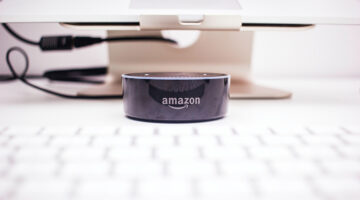 Amazon echo dot near laptop