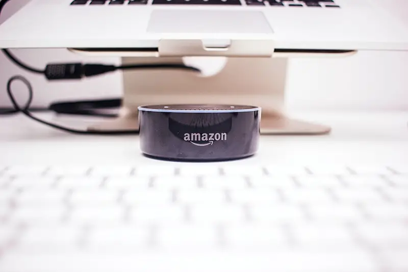 Amazon echo dot near laptop