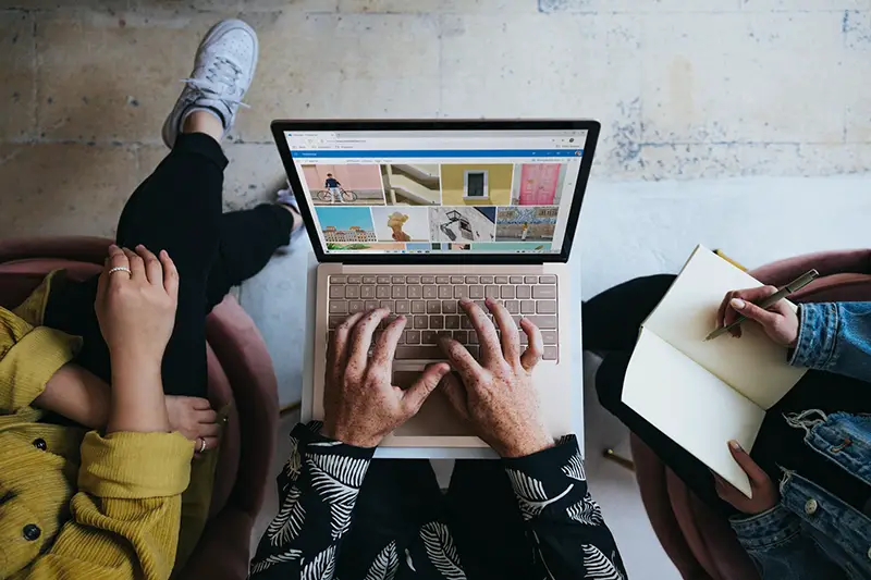 Person using mircosoft surface laptop