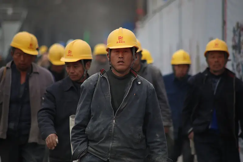 Group of workers wearing  yellow safety helmet