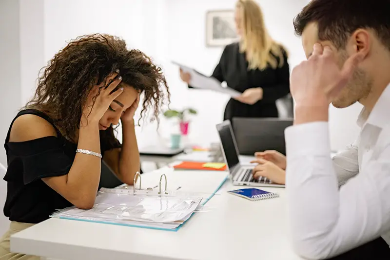 Stressed woman working at the office