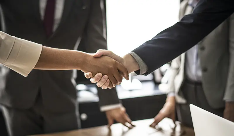 Business people shaking hands in a meeting room