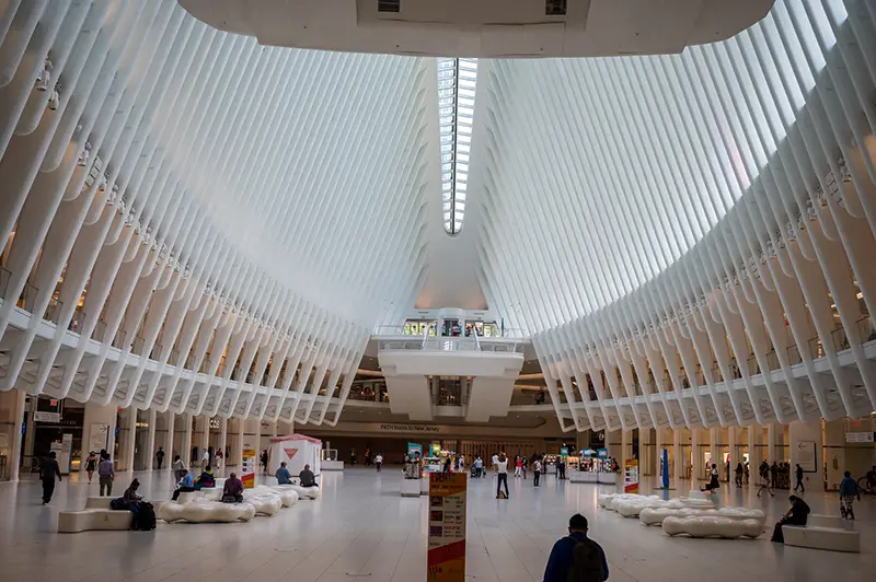 People walking inside the white building