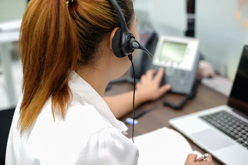 close up focus on headphone of a call centre agent