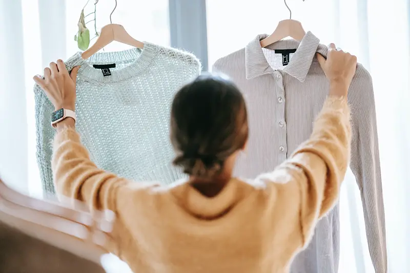 Woman demonstrating clothes in the store